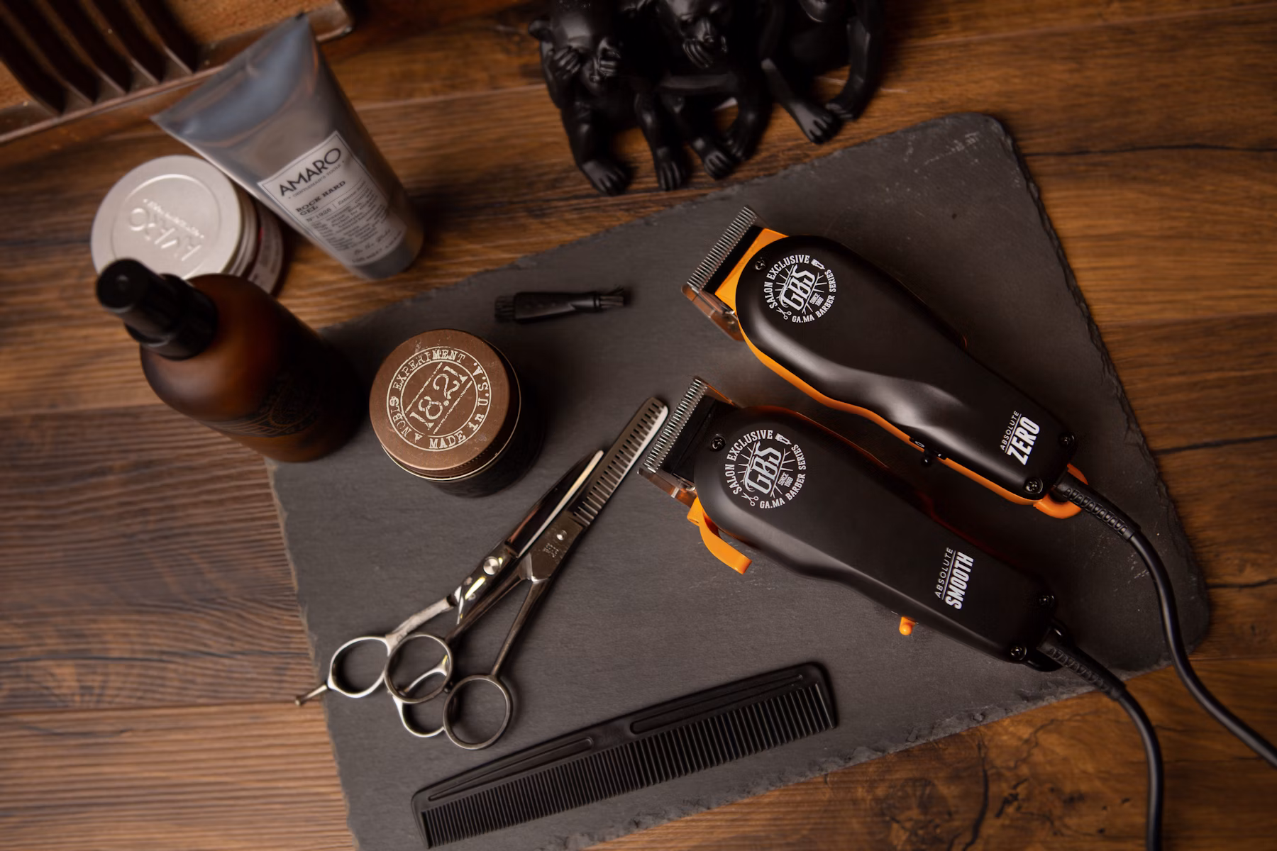 Barber tools and equipment on wooden surface
